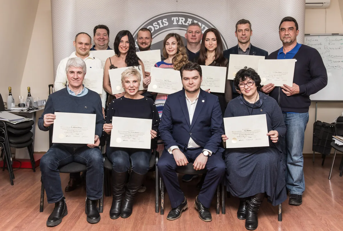 Graduates completing the multi-month in-person training program
