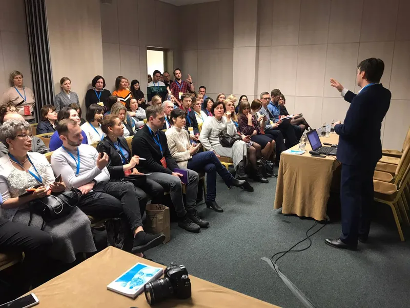 Andrei Efremov presenting at a medical research symposium