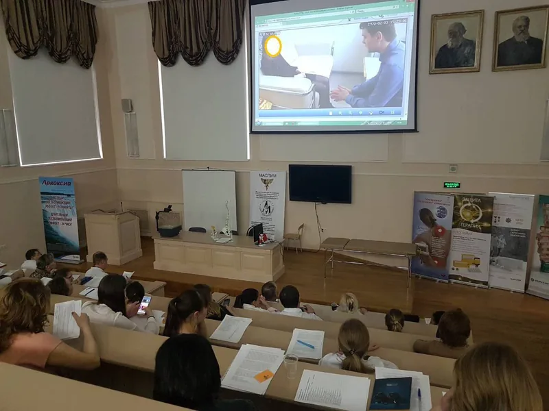 Andrei Efremov presenting to physicians and psychologists at a professional conference